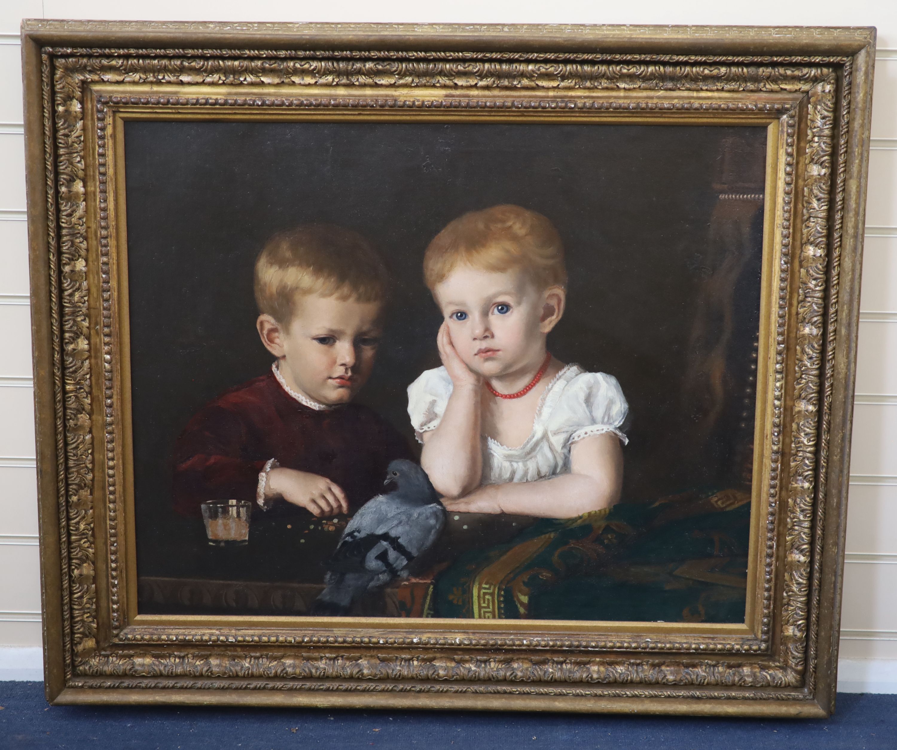 19th Century French School, Two children feeding a pigeon, Oil on canvas, 58 x 72cm.